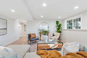 Living room featuring wood finished floors and recessed lighting