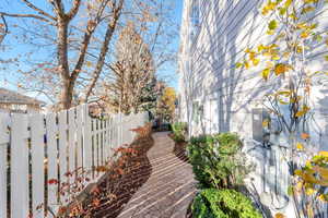 View of side of property with a fenced backyard