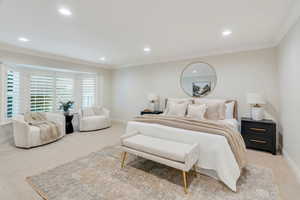 Bedroom with crown molding, light carpet, and recessed lighting