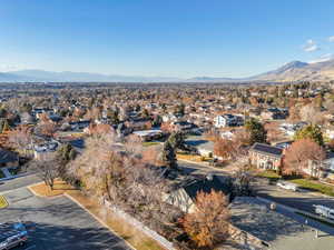 Aerial perspective of suburban area with a mountain backdrop