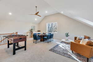Rec room featuring vaulted ceiling, carpet flooring, recessed lighting, a skylight, and ceiling fan