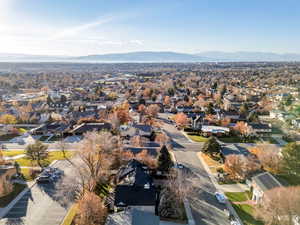 Aerial view of residential area featuring a mountain backdrop
