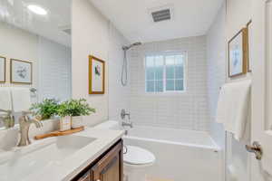 Bathroom with vanity and shower / bathtub combination