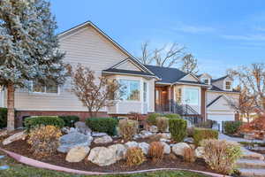 View of front of property featuring a shingled roof