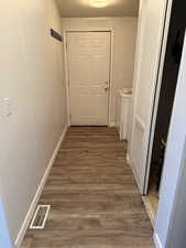 Rear entrance and utility space.  Washer and dryer are included as well as a small freezer