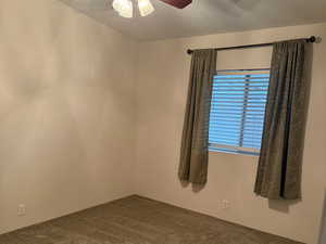 Bedroom 1One of three bedrooms. Large window, and ceiling fan.