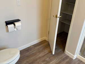En suite bathroom with two large closets with ample storage.