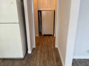 The hallway leads to the utility area and the back door. There is also a pantry (not shown)