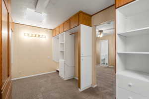 Unfurnished bedroom with carpet and a textured ceiling