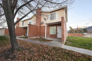 Traditional-style house featuring brick siding