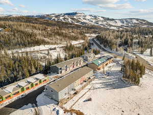 Snowy aerial view with a mountain view