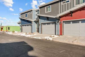 View of front facade featuring an attached garage