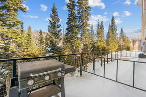 Balcony featuring area for grilling