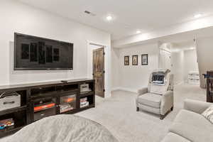 Living room featuring light carpet
