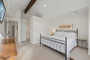 Bedroom with light colored carpet and recessed lighting