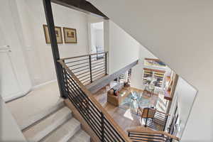 Staircase featuring wood finished floors and baseboards