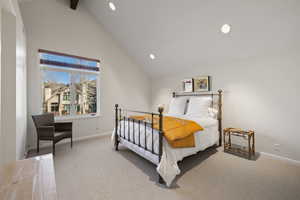 Bedroom with carpet flooring, high vaulted ceiling, and recessed lighting