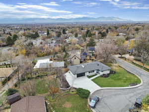 Aerial perspective of suburban area with a mountain backdrop