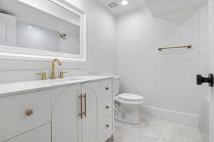 Bathroom with vanity and toilet