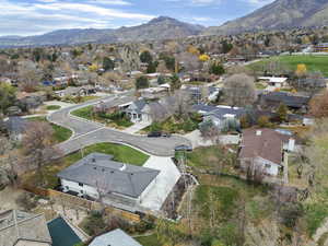 Aerial perspective of suburban area with a mountain backdrop