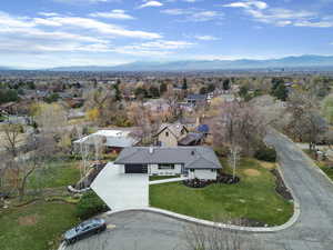 Aerial perspective of suburban area with a mountain backdrop