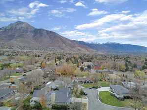 Aerial perspective of suburban area with a mountainous background