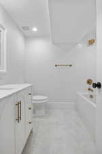 Bathroom featuring vanity and bathtub / shower combination