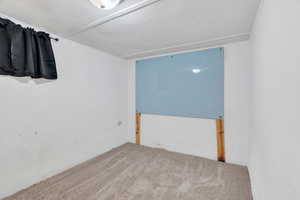 Unfurnished room with carpet flooring