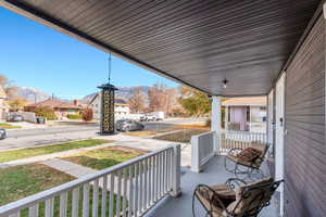 Porch featuring a mountain view and a residential view