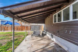 Fenced backyard featuring a patio area