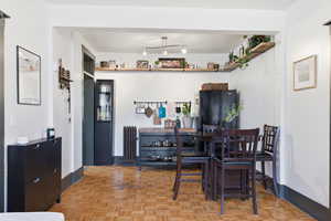 Dining space with radiator and baseboards