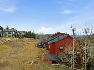 View of yard featuring a wooden deck