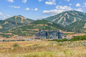 View of mountain backdrop featuring rural landscape