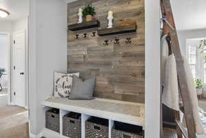 Mudroom featuring carpet floors