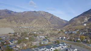 View of mountain backdrop featuring nearby suburban area