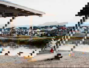 Enjoy free paddle boarding or walks around Oquirrh Lake, within 10 minutes walking distance to the Beach Club (where you get the water crafts) of this home!