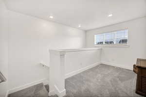 Unfurnished room featuring light colored carpet and recessed lighting