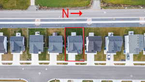 Aerial view of residential area with property parcel outlined