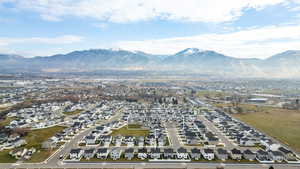 View of property location featuring a mountainous background and nearby suburban area