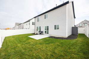 Back of house featuring a patio and a fenced backyard