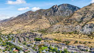 View of mountain backdrop with nearby suburban area