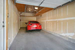 Garage featuring a garage door opener