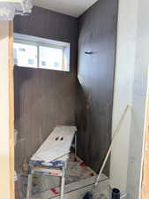 Miscellaneous room with wooden walls