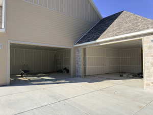 Garage with concrete driveway