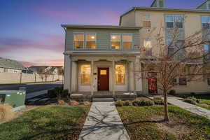 Traditional-style house with covered porch