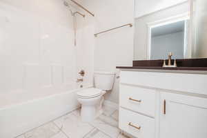 Full bath featuring vanity and  shower combination