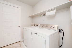 Laundry room featuring separate washer and dryer
