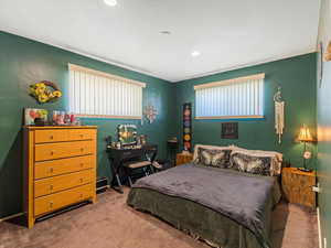 Carpeted bedroom featuring recessed lighting