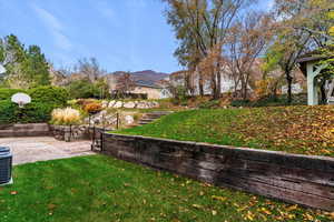 View of green lawn with a mountain view