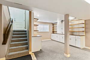 Stairs featuring carpet and recessed lighting